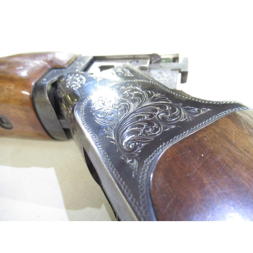 563 - Shotgun certificate required - Miroku O/U single trigger trap shotgun. Floral engraving to lock. Som... 