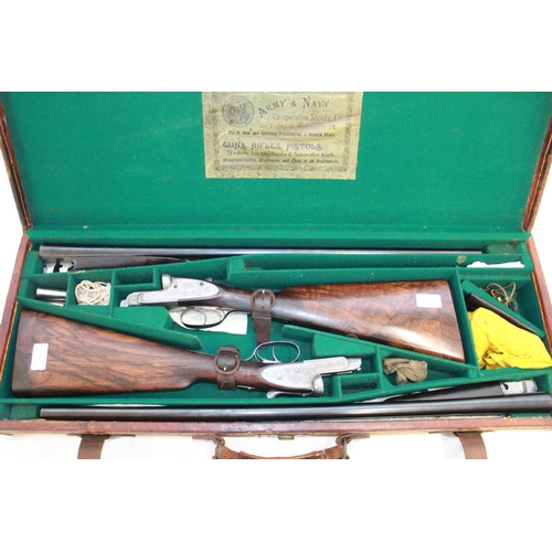 554 - Shotgun certificate required - Cased matched pair of Army & Navy 12B side-by-side shotguns, double t... 