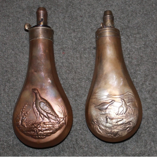 425 - Two brass and copper powder flasks by Sykes, depicting grouse and pheasants