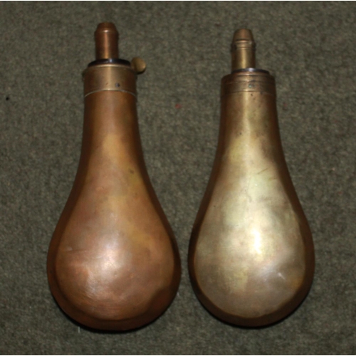 425 - Two brass and copper powder flasks by Sykes, depicting grouse and pheasants