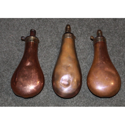 431 - Pair of copper and brass, plain powder flasks by Dixon & Sons. Plain, copper and brass, tear drop po... 