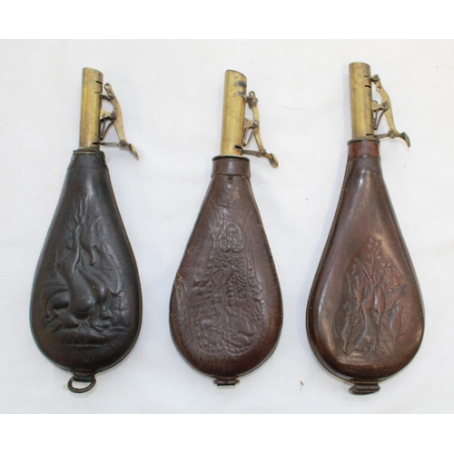 445 - Dixon & sons brass and leather shot flask showing hanging game and two others