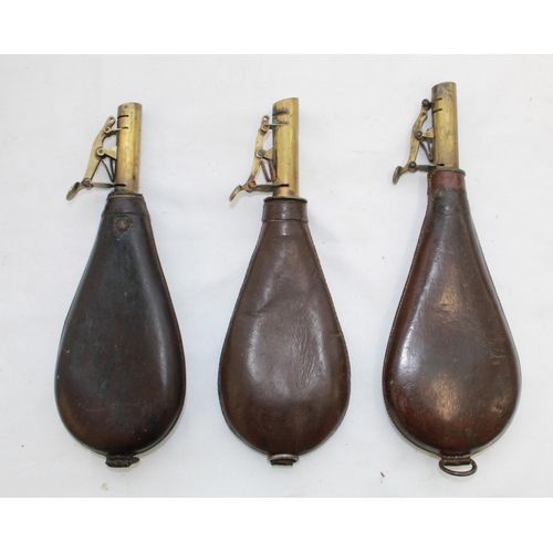 445 - Dixon & sons brass and leather shot flask showing hanging game and two others