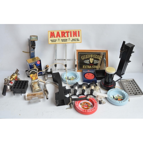 199A - Collection of breweriana to include beer taps, ashtrays, pumps, a Guinness mirror, dart sharpener, a... 