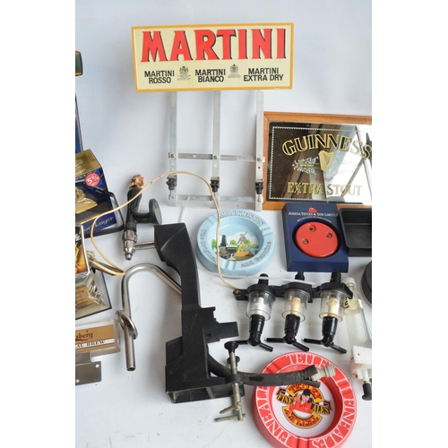 199A - Collection of breweriana to include beer taps, ashtrays, pumps, a Guinness mirror, dart sharpener, a... 