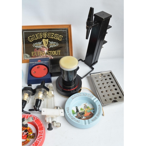 199A - Collection of breweriana to include beer taps, ashtrays, pumps, a Guinness mirror, dart sharpener, a... 