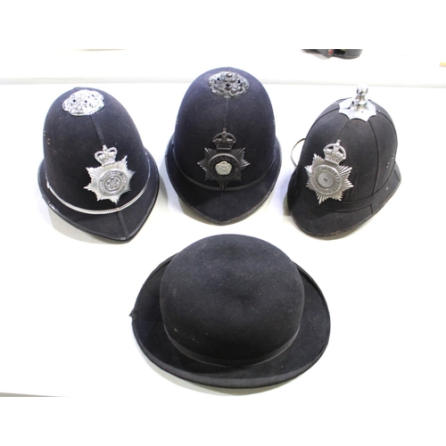 267 - Assortment of police-issue headwear. To include a North Yorkshire police helmet, a North Yorkshire C... 