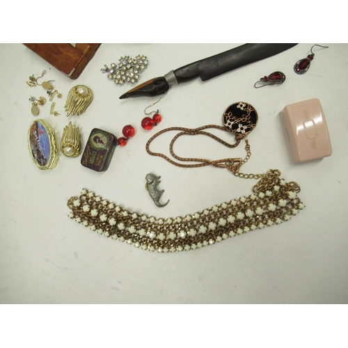 606 - Costume jewellery, a carved ebony letter opener, the Laurel ladies safety razor in tin, a string of ... 