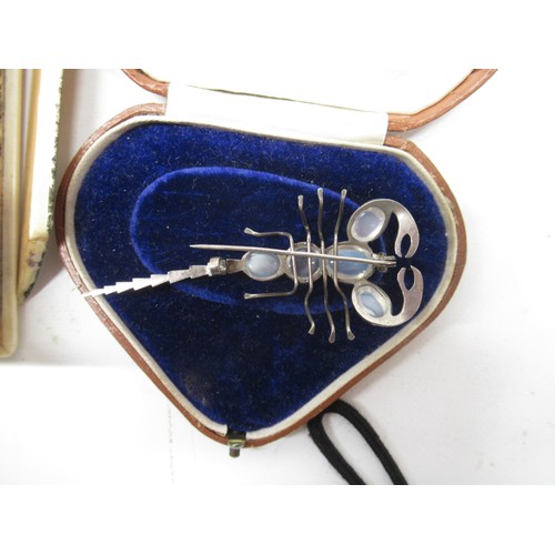 1133 - 20th century white metal and moonstone Scorpion brooch, L8cm, jet type bracelet , a/f, lacquer style... 