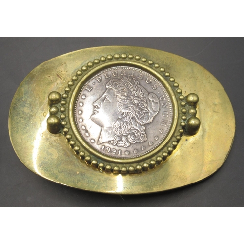 668 - 1921 US dollar coin in brass belt mount, 1902 US dollar (x2), 1921 US Dollar, 1884 US Dollar, 1885 U... 