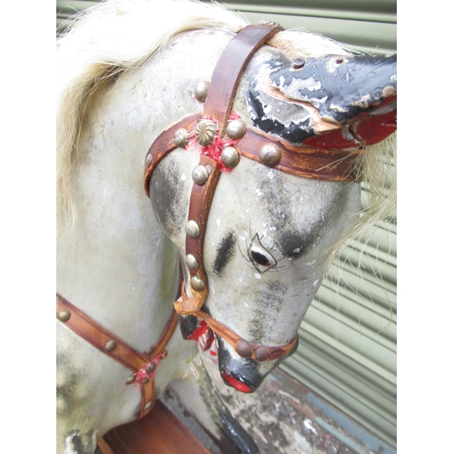 120 - F H Ayres: An Early 20th Century Dapple Grey Painted carved wood Rocking Horse, with brass-studded l... 