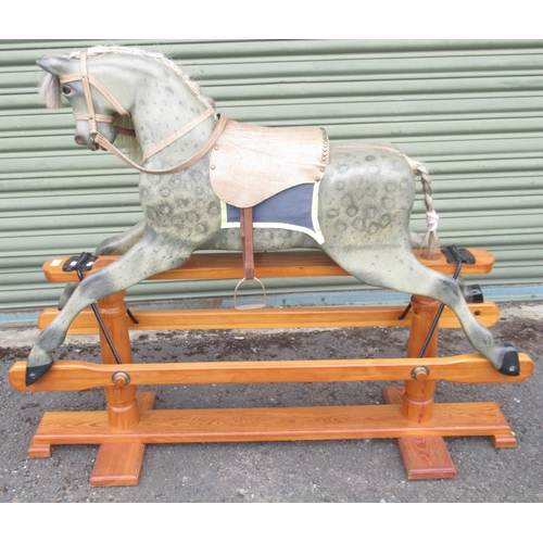 121 - A 20th Century Grey Painted Rocking Horse, with brass-studded leather saddle and under blanket, on a... 