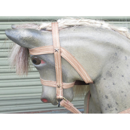 121 - A 20th Century Grey Painted Rocking Horse, with brass-studded leather saddle and under blanket, on a... 