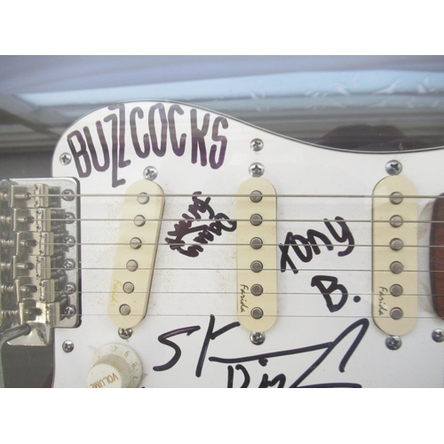 748 - Buzzcocks - Cased Farida electric guitar signed by 4 members of the Buzzcocks : Pete Shelley, Steve ... 