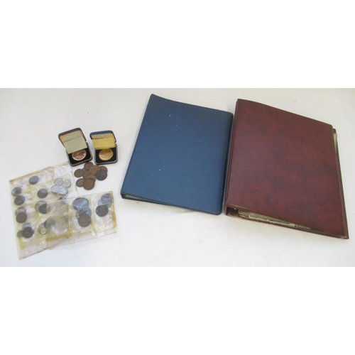 1250 - Two folders of 20th century postcards a small collection of British copper coins and 2 bronze medals... 