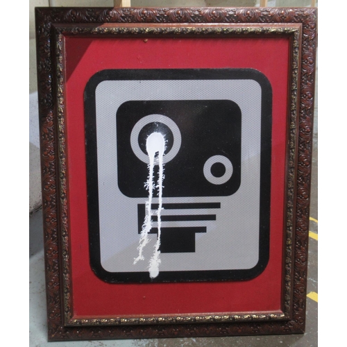 763 - Framed Speed Camera Sign with white paint dripping down camera, 67cm x 82.5cm