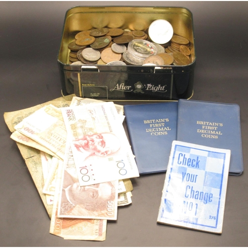 765 - Tin of mixed International coins and banknotes