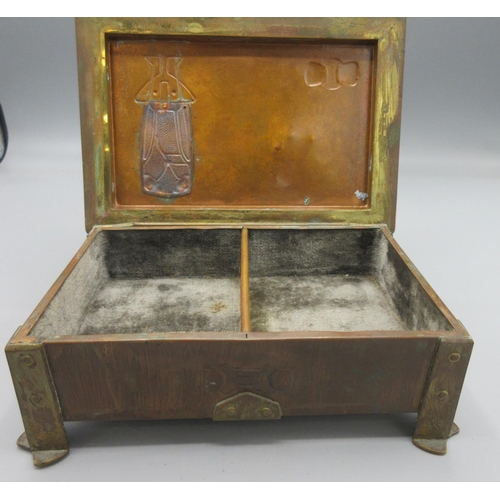 1093 - Arts and Crafts copper and brass table ring box, the hinged cover with enamel inset, fabric lined in... 