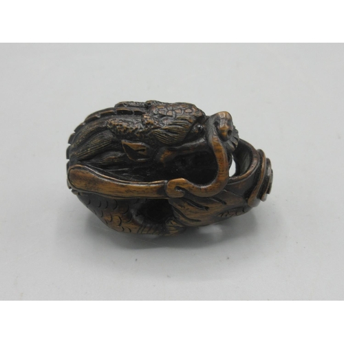 343 - Japanese carved hardwood netsuke in the form of a dragon, inset bone signature panel, L5cm