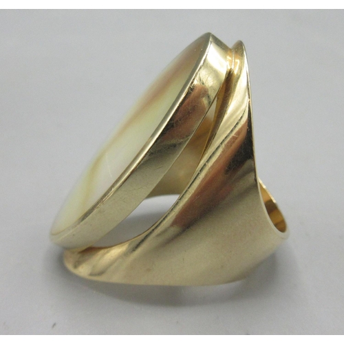 47 - 9ct yellow gold ring set with mother of pearl by C.W.Sellors, stamped 375, face length 3.7cm, size Q... 