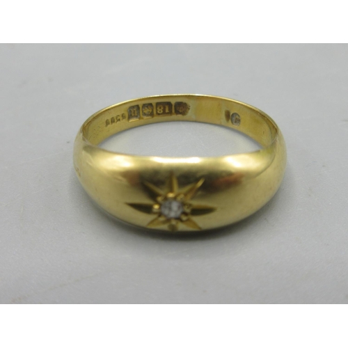 9 - 18ct yellow gold ring set with single diamond in star setting, stamped 18, size R, 3.4g