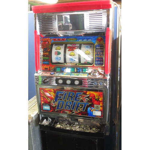 779 - Fire Drift Japanese slot machine with tokens, 47.5cm x 38cm x 81cm