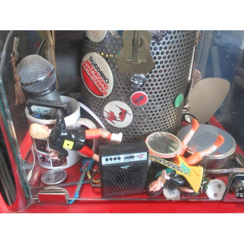 781 - Fossil Classic former display stand filled with badges, and memorabilia inc. The Jam badge , UK Subs... 