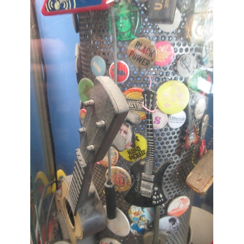 781 - Fossil Classic former display stand filled with badges, and memorabilia inc. The Jam badge , UK Subs... 