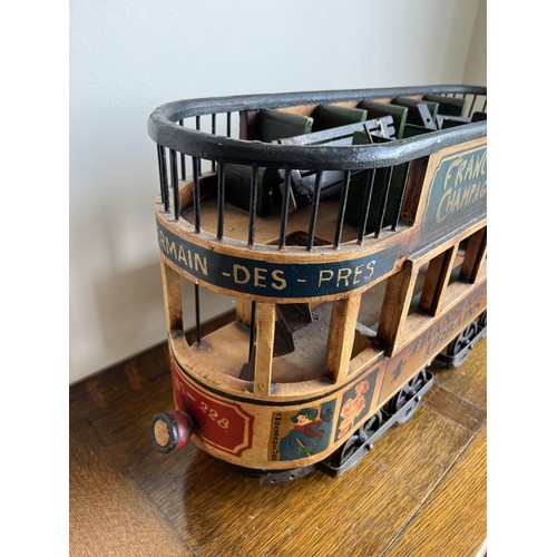 1129 - Painted wood and metal decorative model of a French tram, inscribed ‘Transports Urbains’, L66cm