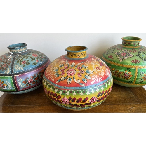 828 - Three Indian painted metal matka (water pots), in blue, red and green, D35cm