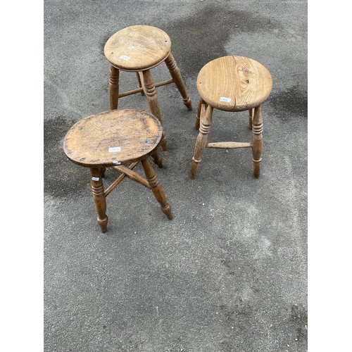 674 - Two beech and ash circular top stools and another with oval top (3)