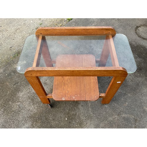 694 - 20th century oak tea trolley with plate glass top and platform shelves on casters, W84cm D44cm H70cm