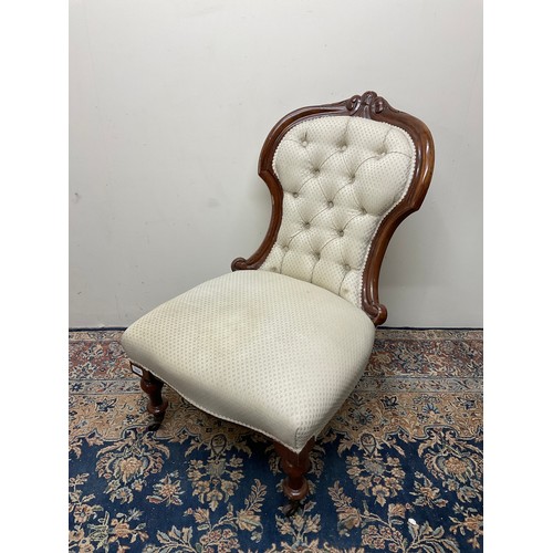 1224 - Victorian carved mahogany framed nursing chair, buttoned back and serpentine seat on turned supports... 