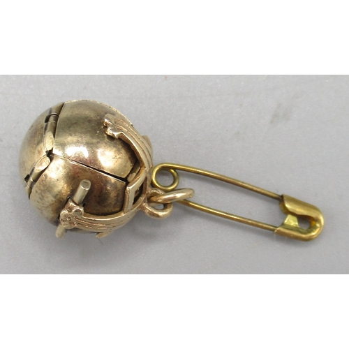 45 - 9ct gold and gilt metal Masonic orb pendant, opening in the form of a cross, engraved with symbols, ... 