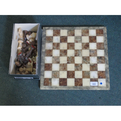 806 - Two colour polished stone chess set with board