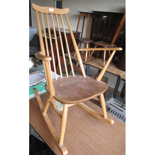 581 - Les Dennis Collection - Ercol stick back rocking chair, impressed marks, label torn off