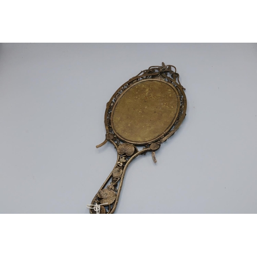 245 - Openwork Japonesque gilt metal hand mirror, probably French, decorated with bamboo, lily pads and a ... 