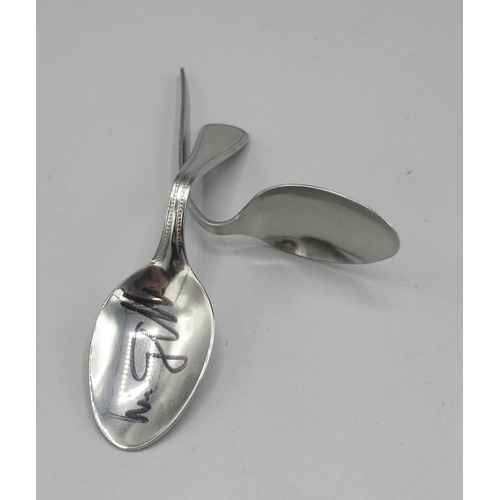 771A - Uri Geller, illusionist, physic and tv personality, two bent spoons, one signed, with provenance, ma... 