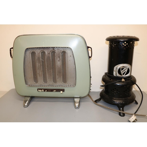 58 - Lisa George Collection - Valor black enamelled metal stove, H50cm and an AEG electric radiator c1950... 