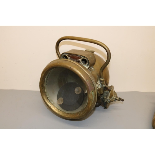 117 - Motoring related items incl. Desmo Birmingham car horn; Rolax `Roadlight 267'; radiator caps, etc.