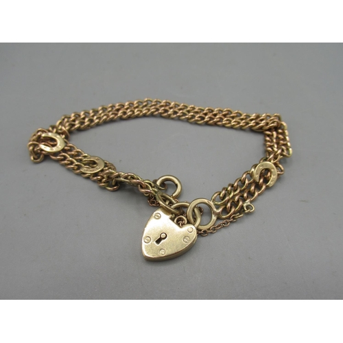 5 - 9ct rose gold double chain link bracelet with yellow gold horseshoes and heart padlock, stamped 375,... 