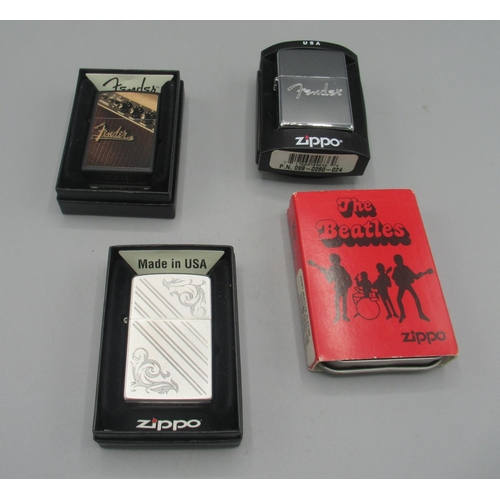 352 - Zippo petrol lighter 'The Beatles', cased with outer cardboard slip; two Zippo 'Fender' petrol light... 