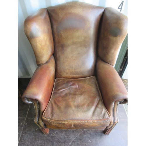 838 - George 111 style brown leather upholstered wing back arm chair, with loose seat cushion square suppo... 