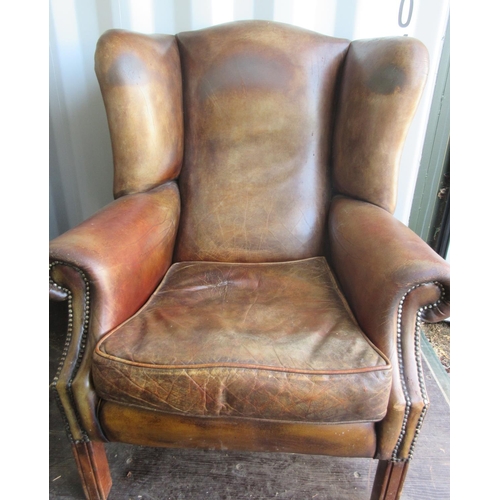 838 - George 111 style brown leather upholstered wing back arm chair, with loose seat cushion square suppo... 