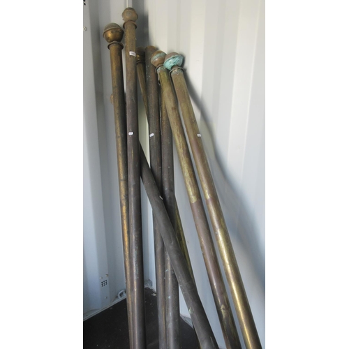 840 - Eight lacquered brass curtain poles, some with rings, some finials lacking, L207cm max (8)