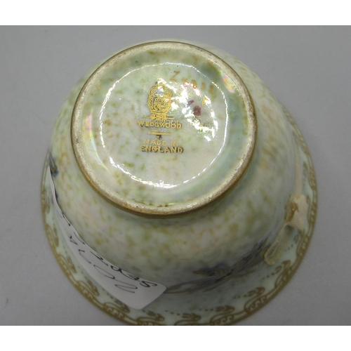 1155 - Wedgwood lustre octagonal bowl, exterior decorated with gilt Chinese charms, on a mottled puce groun... 