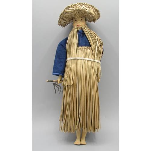 1247 - Chinese 'Door of Hope' farmer doll c1930s, carved pearwood with straw and blue linen costume, H29cm