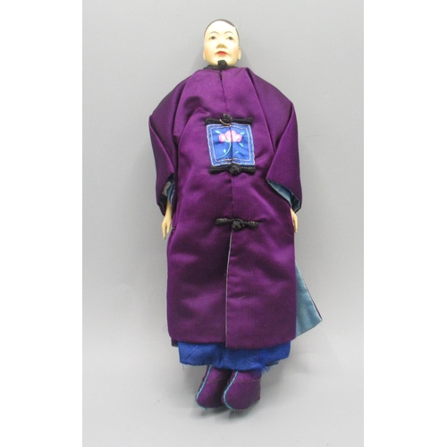 1248 - Chinese 'Door of Hope' groom doll c1930s, carved pearwood with hand-embroidered purple silk costume,... 