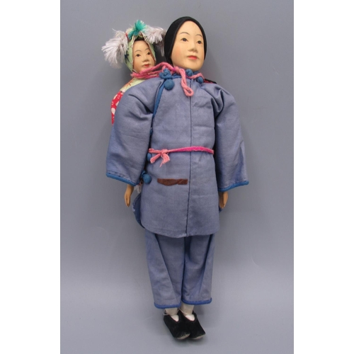 1253 - Chinese 'Door of Hope' doll modelled as a woman with a child on her back, c1930s, carved pearwood, H... 