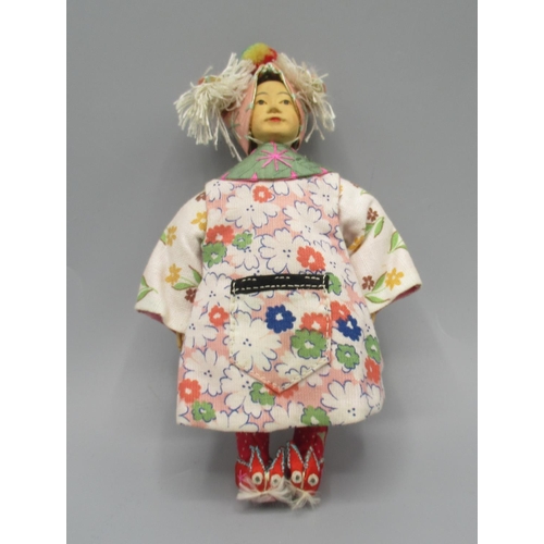 1254 - Chinese 'Door of Hope' child doll 1930s, carved pearwood with hand-embroidered costume, shoes and ta... 